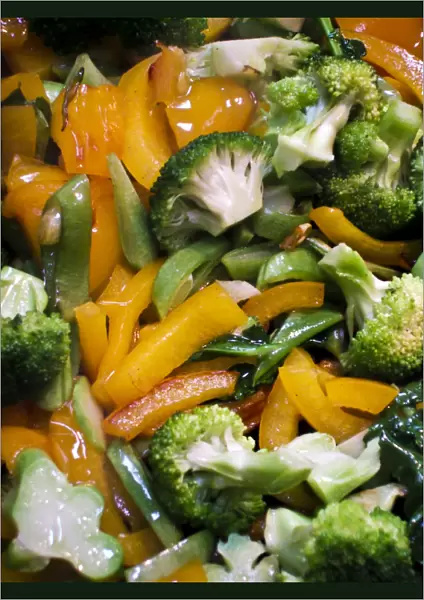 Quickly stir fried, mixed vegetables in the pan credit: Marie-Louise Avery  /  thePictureKitchen