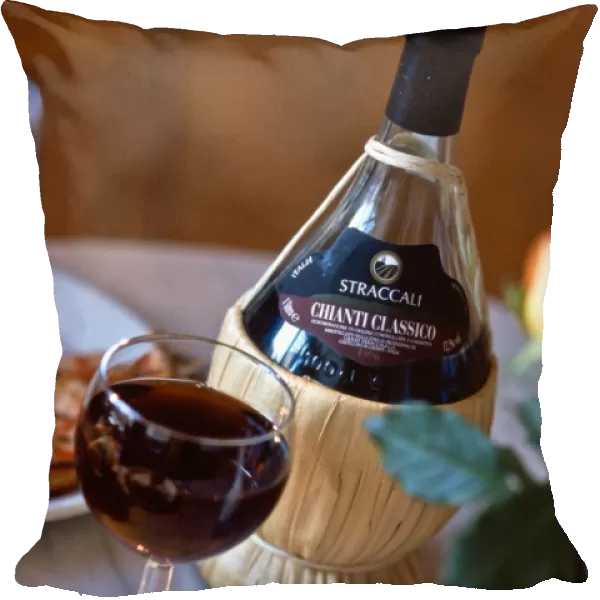 Chianti classico in traditional old fashioned raffia covered bbottle on restaurant