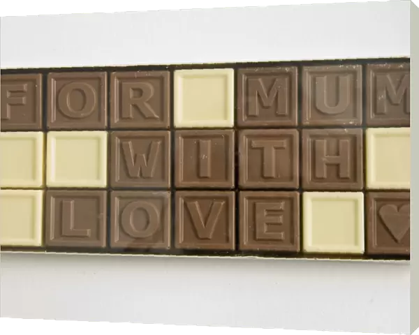 Chocolate letters spelling For Mum with love in cellophane box as Mothers day
