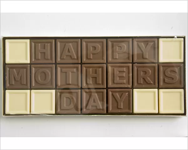 Chocolate letters spelling Happy Mothers Day in cellophane box as Mothers day