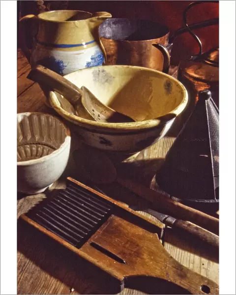 A collection of old and antique kitchenalia, tools and equipment including jugs, bowls