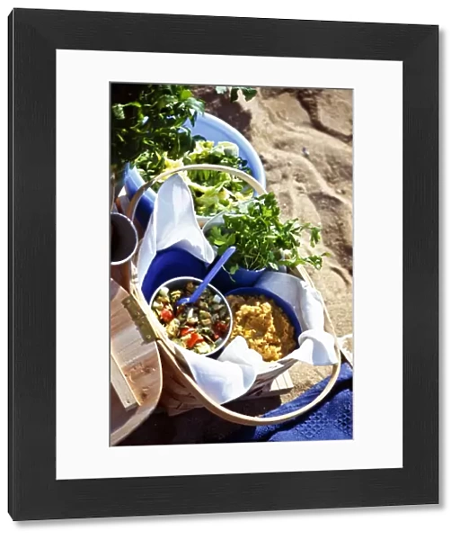 Beach picnic with salads in bowls and baskets credit: Marie-Louise Avery  /  thePictureKitchen