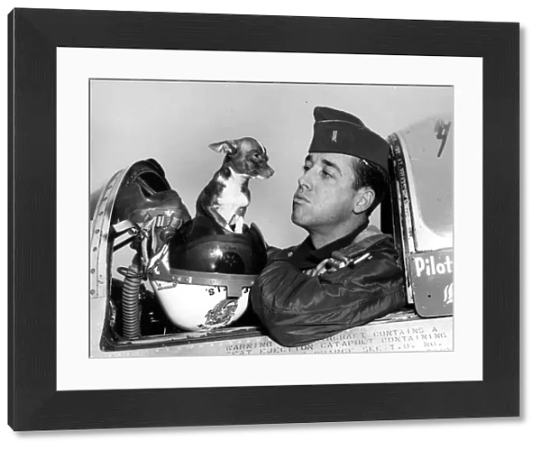 Hows about a little kiss, Chihuahua? First Lt James A Mills, of Charlotte, North