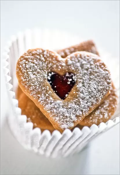Pretty heart shaped biscuits in white paper muffin case9 credit: Marie-Louise Avery