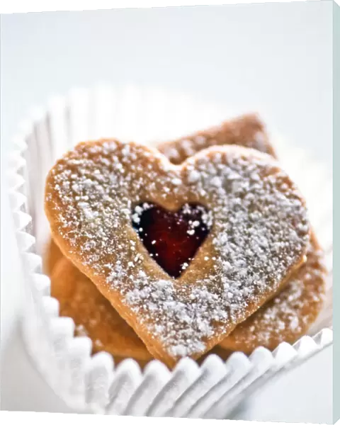 Pretty heart shaped biscuits in white paper muffin case9 credit: Marie-Louise Avery