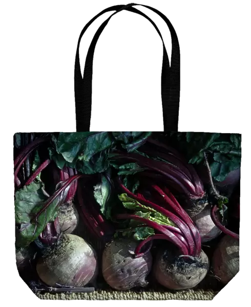 Fresh whole raw beetroot for sale in box outside traditional greengrocers shop credit