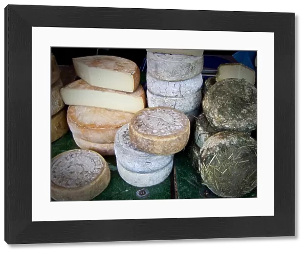 Italian cheeses on market stall in Edenbridge Kent credit: Marie-Louise Avery  / 