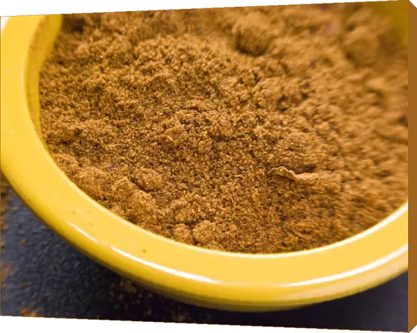 Ras-el-harnout (North African spice mixture), in small yellow bowl credit: Marie-Louise