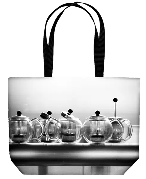 Glass Bodum teapots on metal shelf in restaurant credit: Marie-Louise Avery  /  thePictureKitchen