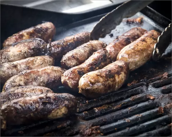 Free range pork sausages being grilled at Penshurst farmers market