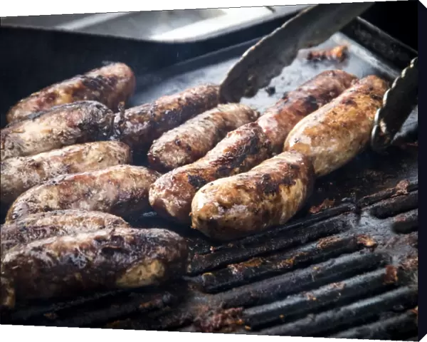 Free range pork sausages being grilled at Penshurst farmers market