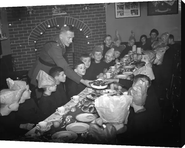 Boys being served their Christmas dinner by an officer at the Army Bands School in