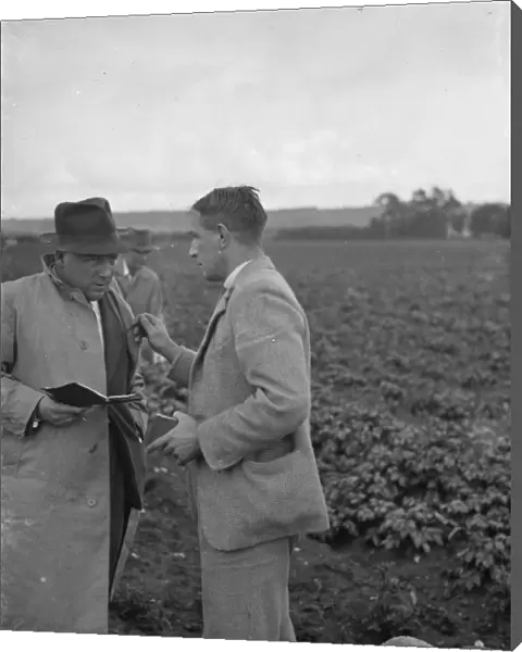 Potato demonstration, Cottons farm. Mr J N Sharrock holding the scales. Mr C