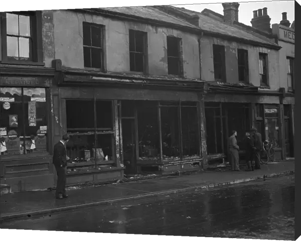 The burnt - out remains of shops in Swanscombe, Kent after a fire