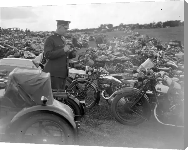 Brands Hatch near Swanley, Kent. A policeman searches for stolen motorbikes. 1933
