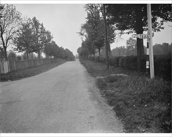 A road sign obscured. 1938