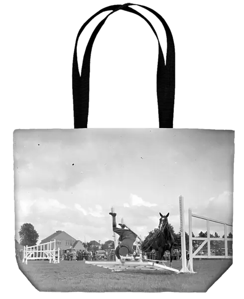 Show Jumping at Westerham Show Hall in Kent. A nasty fall. 1934