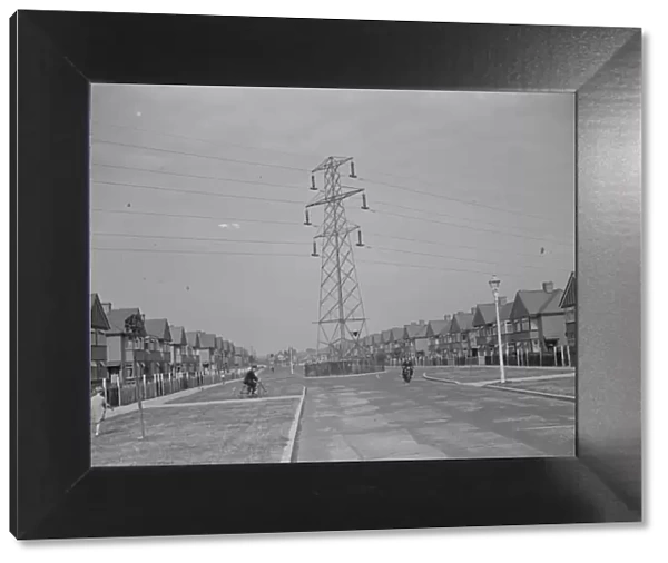 Electricity pylons crossing the road in Sidcup, Kent. 1935
