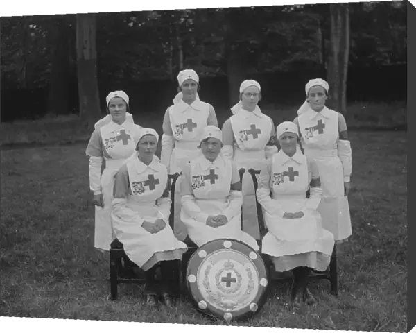 Nurses pose with the Stanley Shield for the British Red Cross Society following the