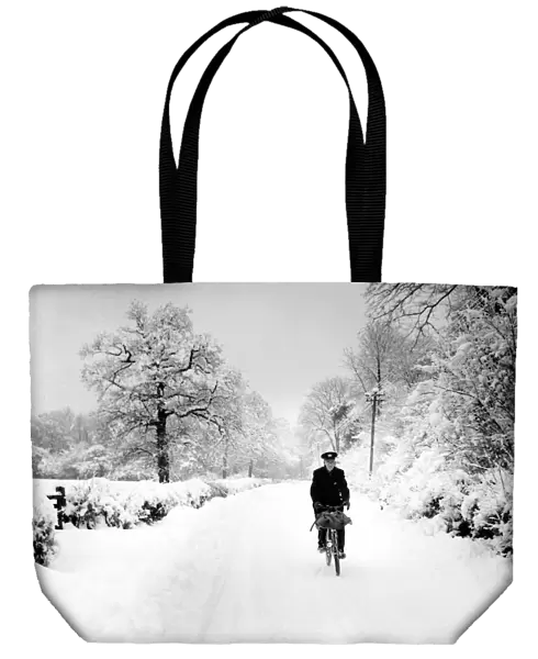 Postman cycling through snow in Bough Beech, Kent. 28th December 1962