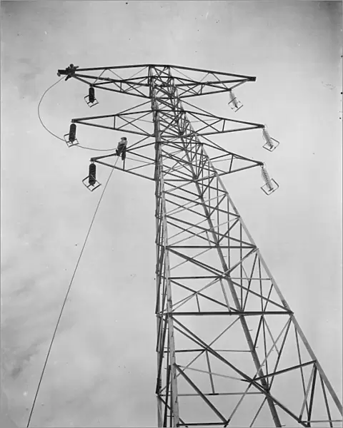 Erecting electricity pylon wires on a grid in Gravesend, Kent. 1939