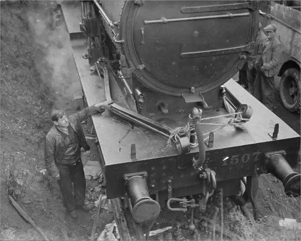 Engineers on the track at the front of the locomotive after being derailed at Swanley