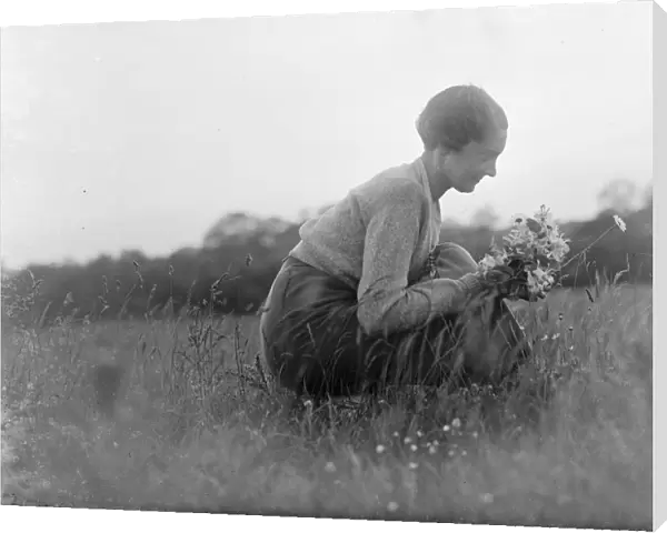 Haken. Miss Silhouette. Young woman picking wild flowers in a field. 1935