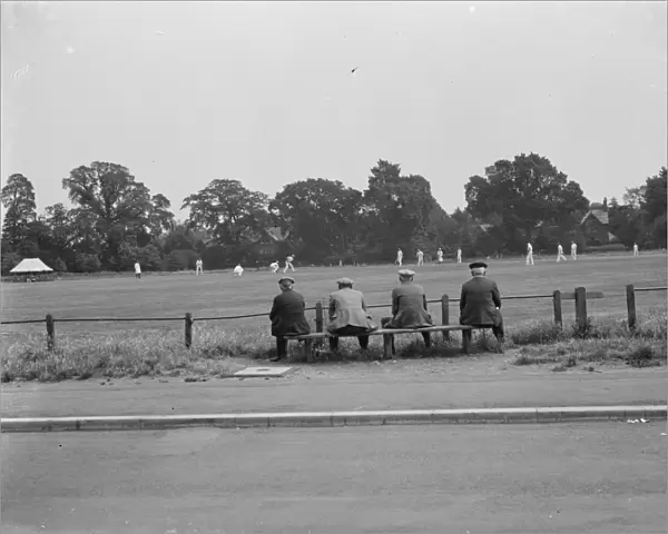 A group of men watch a cricket game in Chislehurst. 1939