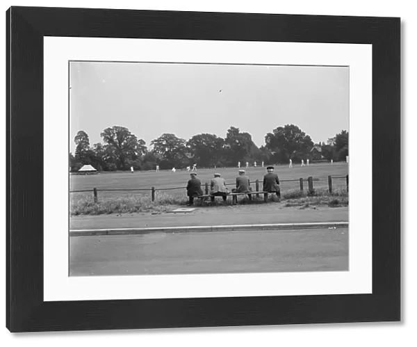A group of men watch a cricket game in Chislehurst. 1939