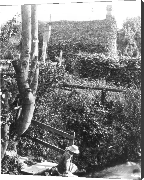 A Victorian girl fetching water from a stream at the bottom of the garden