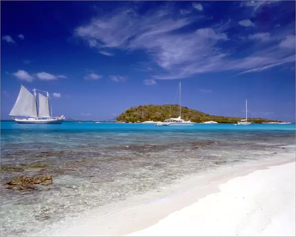 TROPICAL ISLANDS Palm Island, in the Grenadines of te west Indies. Beach and boats