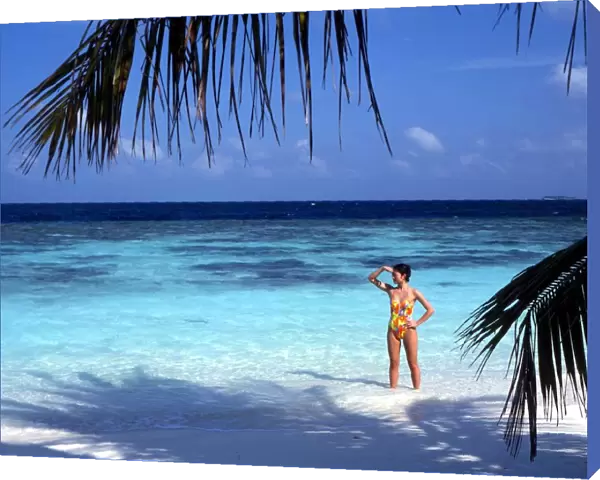 TROPICAL ISLANDS - Maldives Bandos, with girl of beach