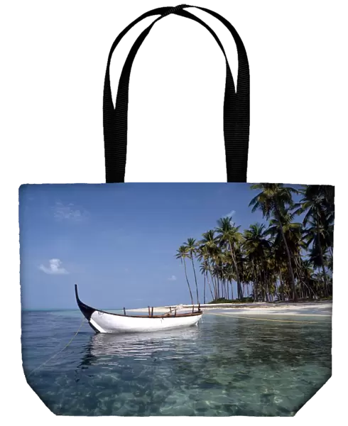 TROPICAL ISLANDS - Laccadives Bangaram island, with traditional boat. The Laccadive
