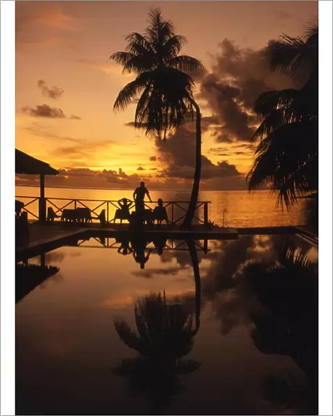 TROPICAL ISLANDS French Polynesia Hotel pool and sea at sunset, Morea, off Tahiti