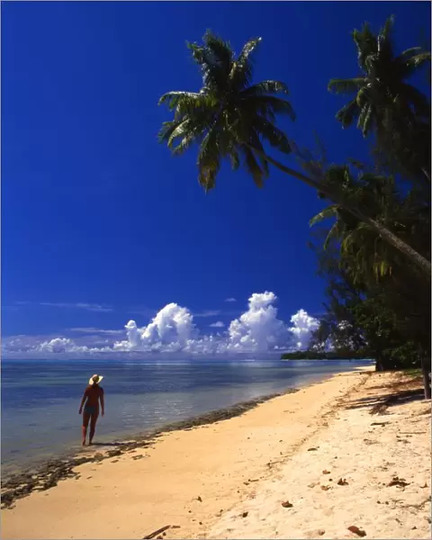 Woman on beach on the island of Morea, near Tahiti