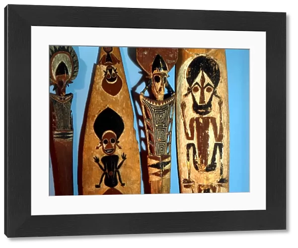POLYNESIAN MYTHOLOGY Wooden paddles, painted with traditional figures. From the