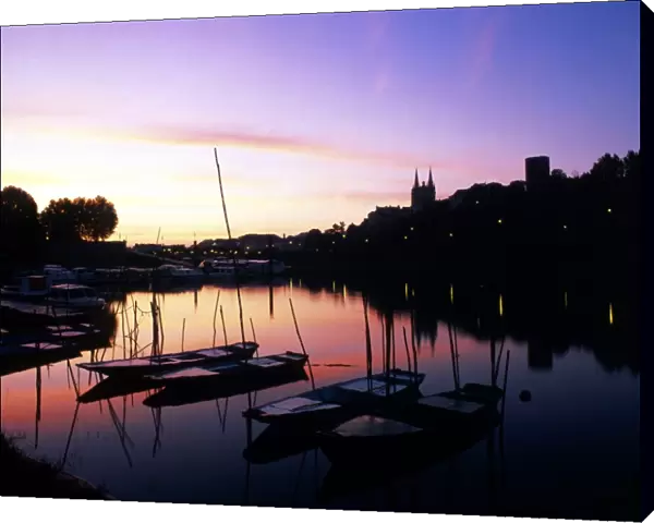 Boats at sunset. Angers, on the banks of the river Maine, Loire Valley. France