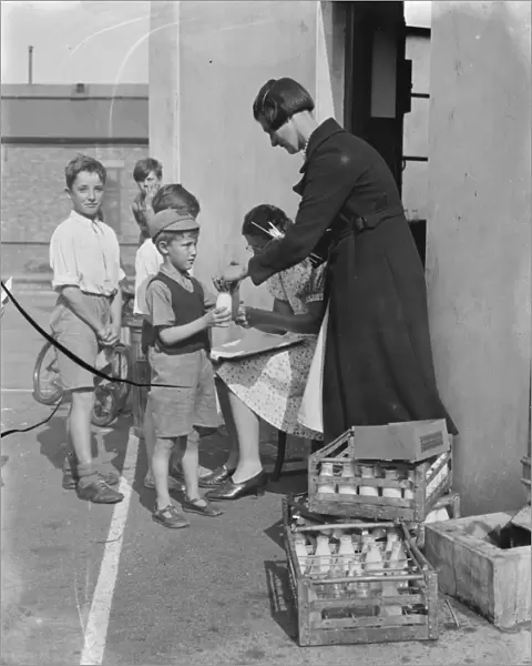 Free milk for children on holiday in Crayford, Kent. 1939