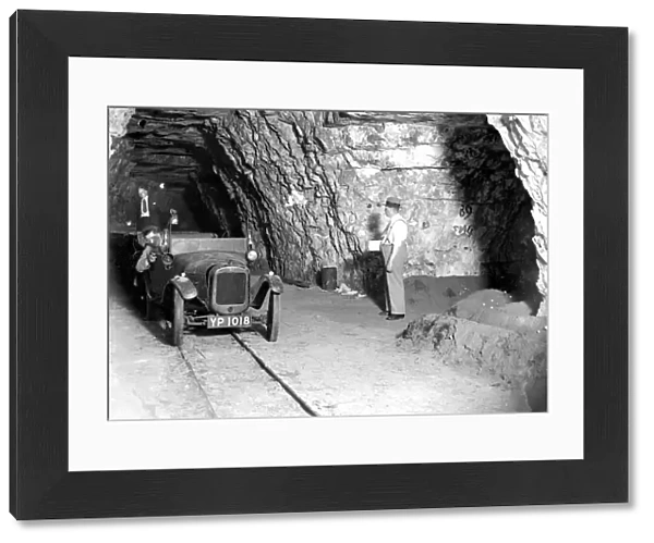 Mushroom growing at a Chislehurst cave. An Austin 7 is used for transport. 1934