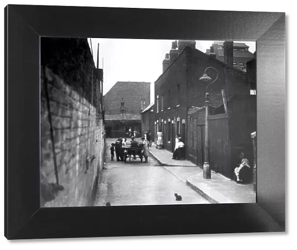 A slum Street in Limehouse in the early 1930 s. Many such places did not survive