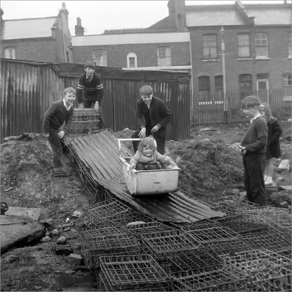 Children Battersea Playing on Bobsled; 10 April 1963