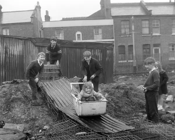 Children Battersea Playing on Bobsled; 10 April 1963