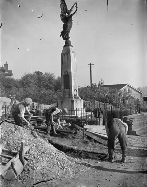 The construction of an Air Raid Precautions shelter beneath a war memorial in Swanley