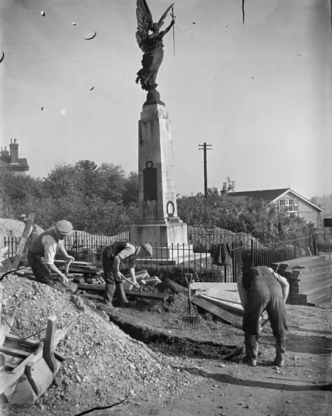 The construction of an Air Raid Precautions shelter beneath a war memorial in Swanley