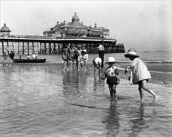 Young children having holiday fun in the sea at Eastbourne. 9 August 1916