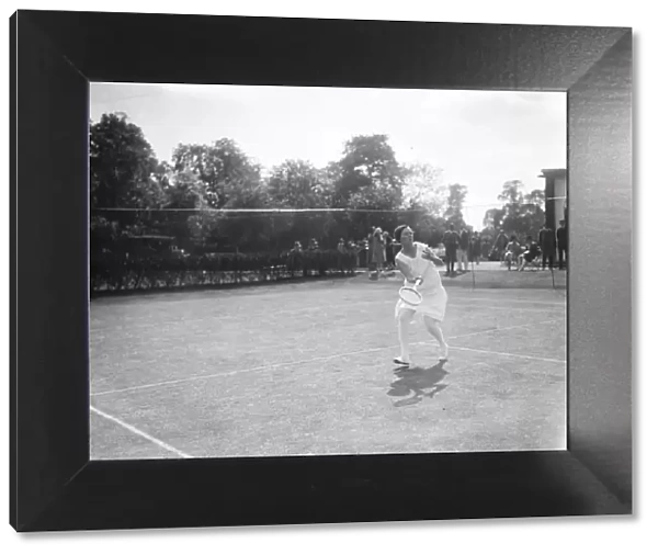 South African women tennis players practice at Hurlingham. Mrs Peacock in play