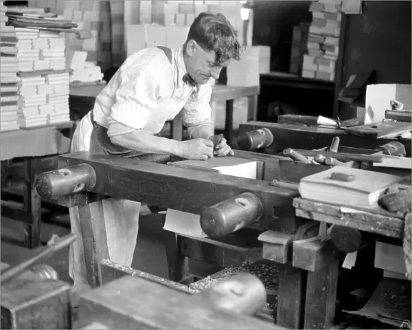At Messrs James Burns Book Binding works at Esher. Gilding the edge. 15 May 1923