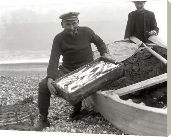 The Coxswain of the Aldeburgh lifeboat, Charlie Mann, with a catch of herrings