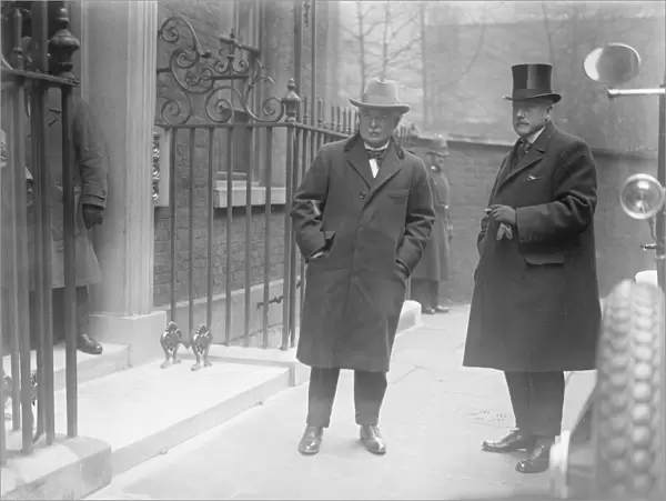 The Premiers return. Mr Lloyd George with Mr McCurdy photographed outside no