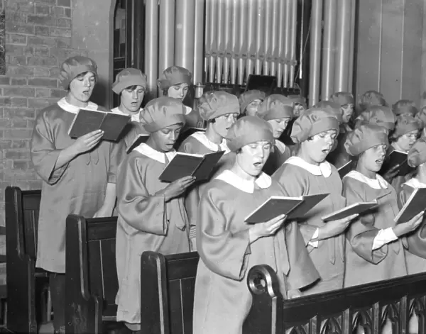 Girl choristers at Dr Barnardos homes, Berkingside, practising christmas carols